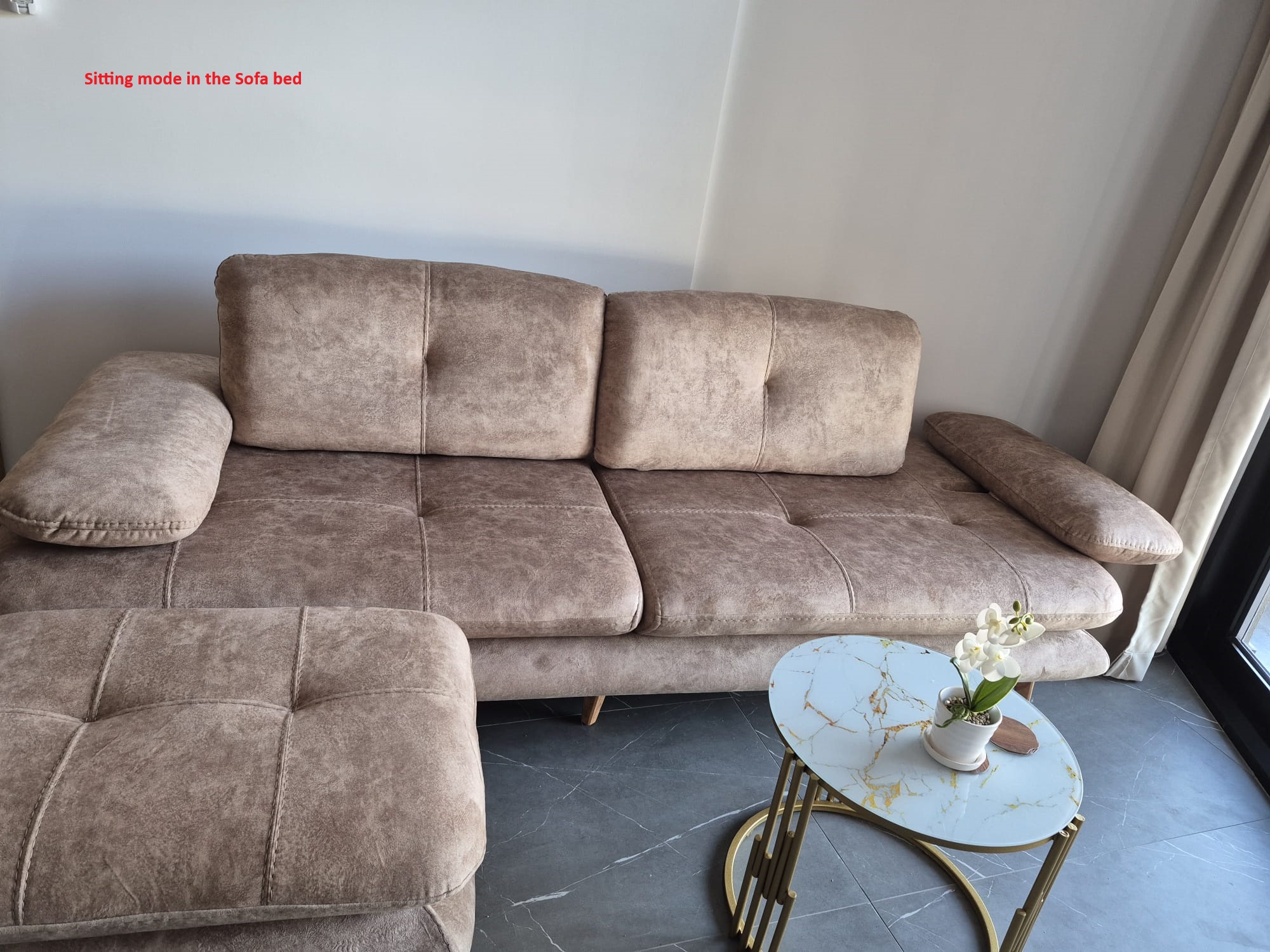 Sofa bed in sitting mode
